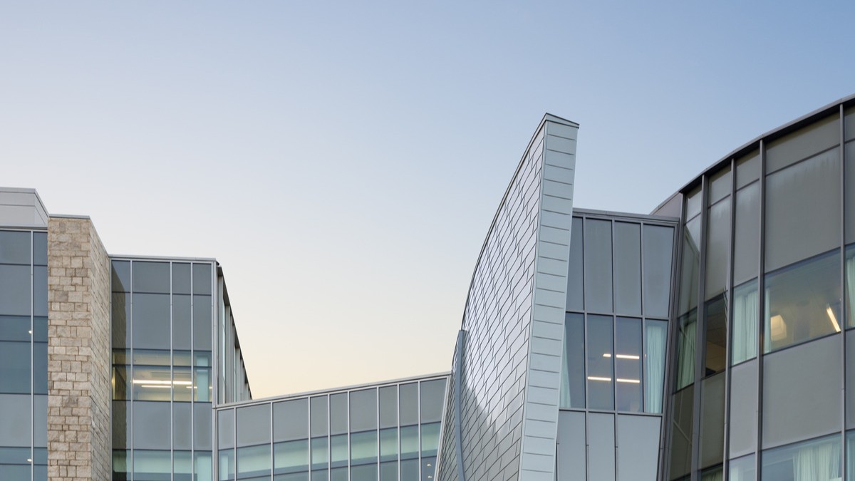 skyline of a modern healthcare building showcasing the top of the building's architecture skyline of a modern healthcare building showcasing the top of the building's architecture