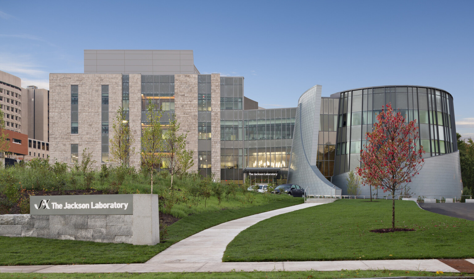 exterior of building with The Jackson Laboratory sign in the front left; unique structure that creates futuristic architecture structure