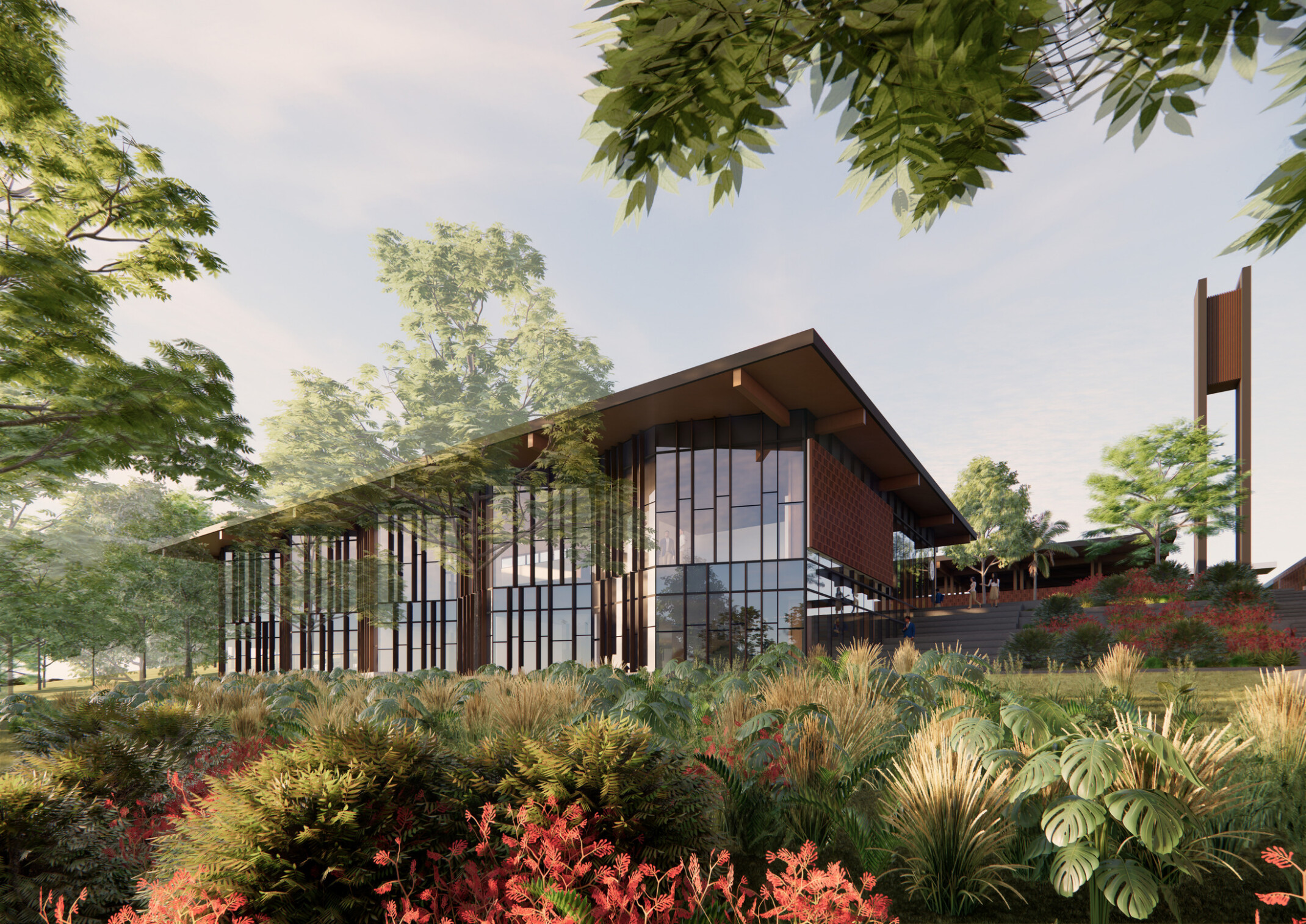 Exterior of the school featuring warm wood tones, large windows, tucked neatly into a scenic campus