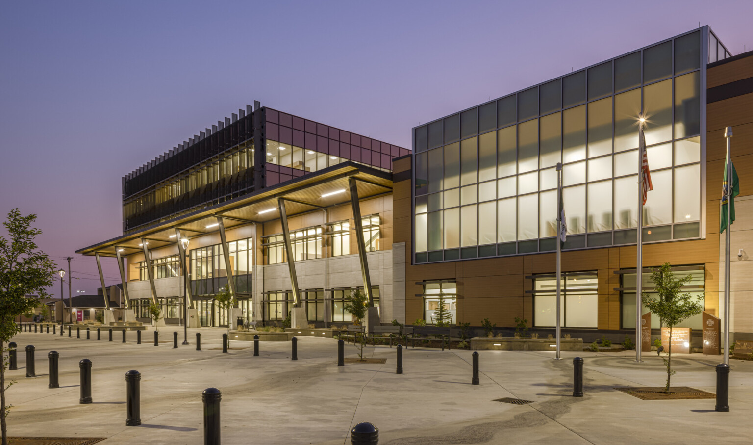 The main entrance in the four-story central tower of Marysville Civic Campus welcomes residents and visitors, sets a new architectural standard for the city and engages with an adjacent city park, main entrance in the four-story central tower, and employs floor-to-ceiling privacy windows on the upper level