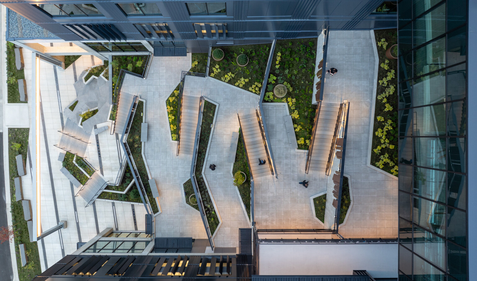 aerial view of a courtyard; zigzaging pathways create a geometric pattern