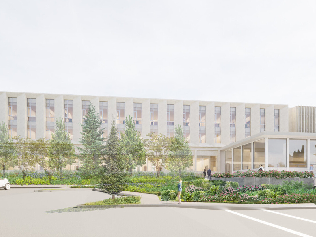 Rendering of a multistory office building with large glass atrium out front surrounded by trees and lush landscaping