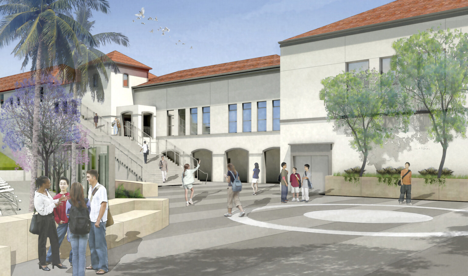 Courtyard looking towards base of stairs. Rounded gathering space in front, arches in building to covered walkway