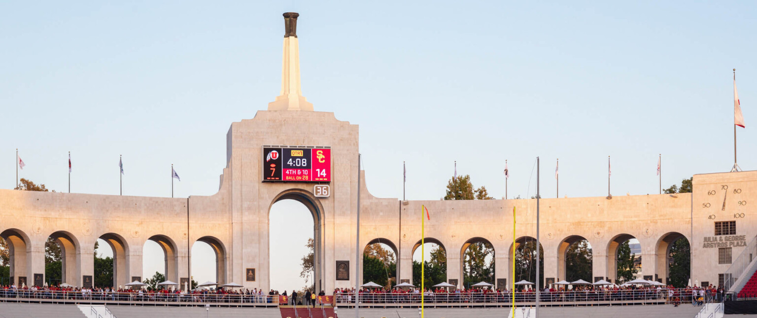 Entry concourse of Los Angeles Memorial Coliseum with central tower and Olympic Cauldron on top of a spire
