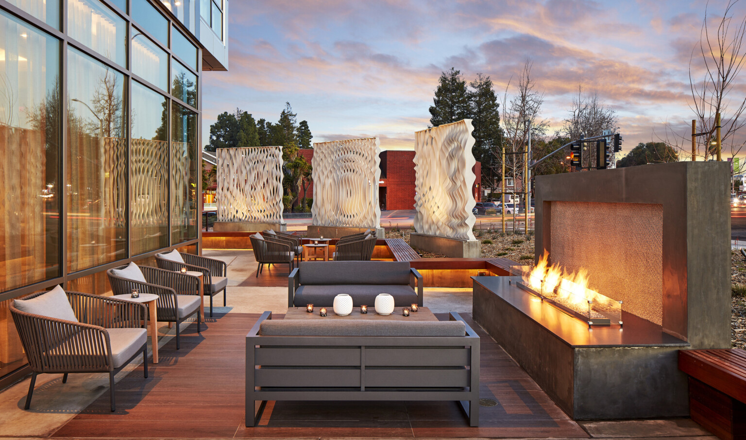 outdoor fireplace and seating area with multidimensional screen dividers