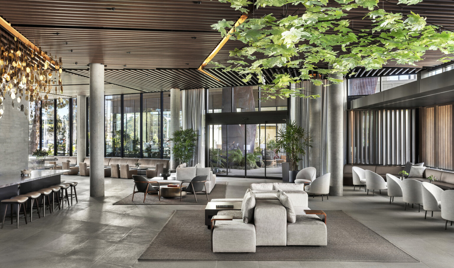 Floor-to-ceiling window allow daylight to wash the interior lobby and creates connection points to the central breezeway, blurring the lines between the inside out.