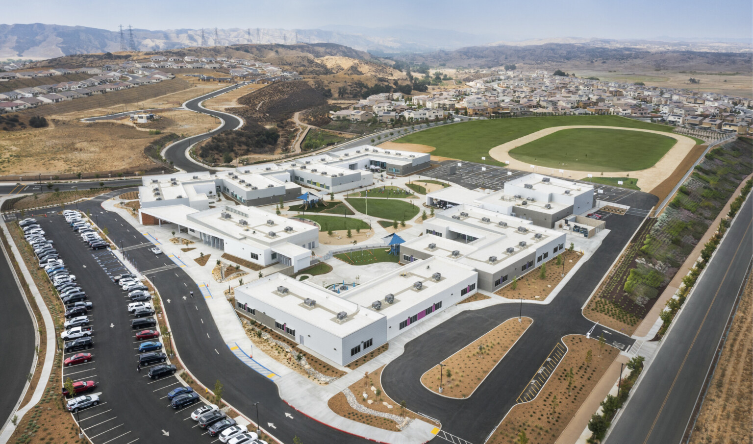 aerial view of campus with green grass snaking through