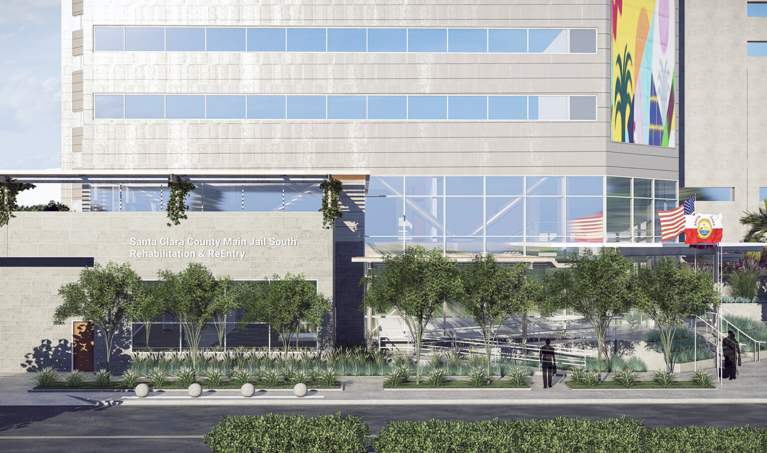 Close up of exterior side. Ramp, right. Left, a stone wall reads Santa Clara County Main Jail South, Rehabilitation & ReEntry