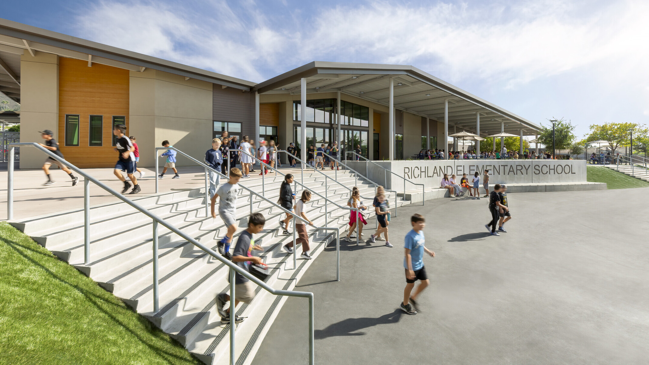 Richland Elementary School front entrance with shade canopy over front steps and concrete sign