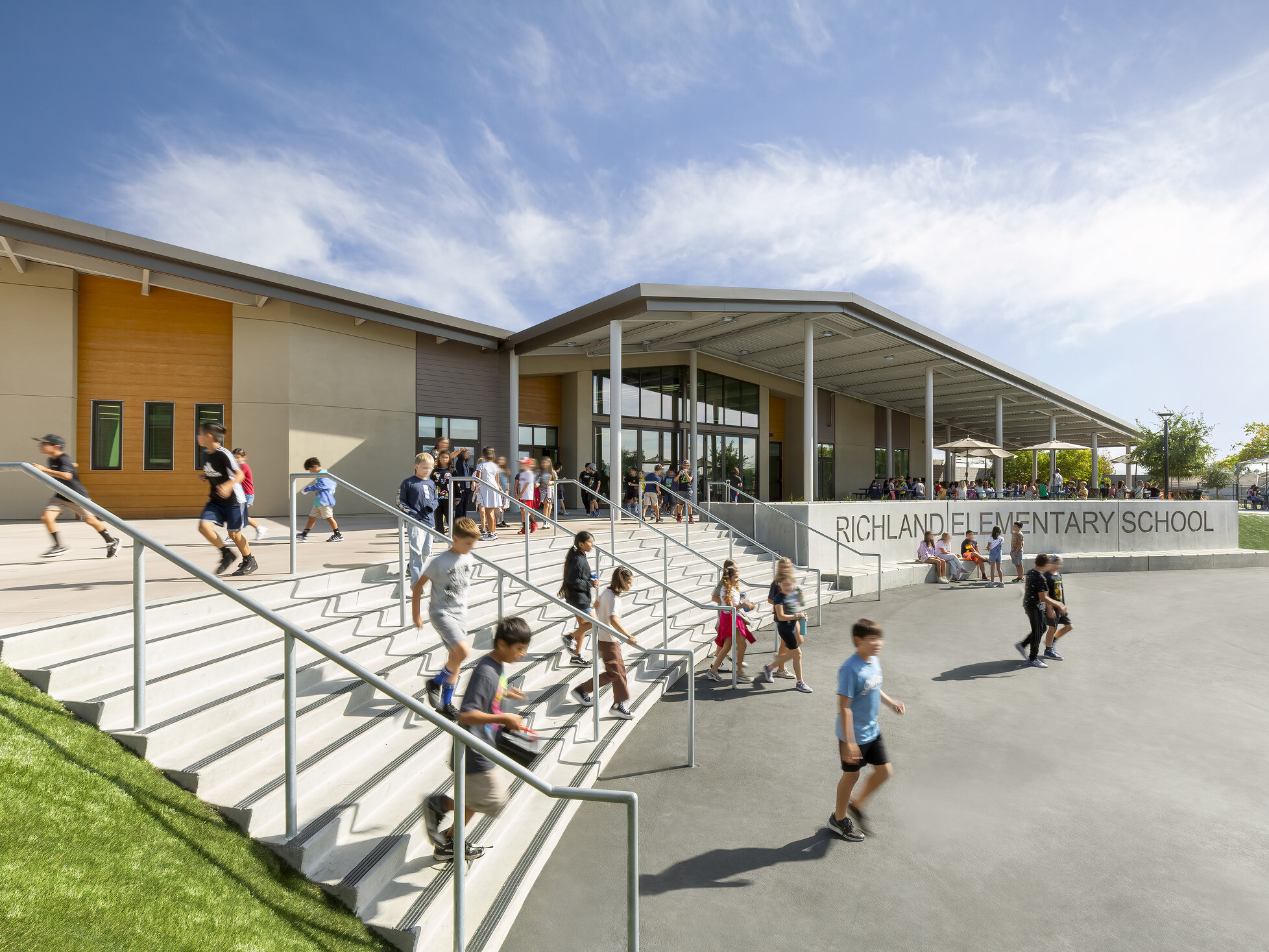 Richland Elementary School front entrance with shade canopy over front steps and concrete sign