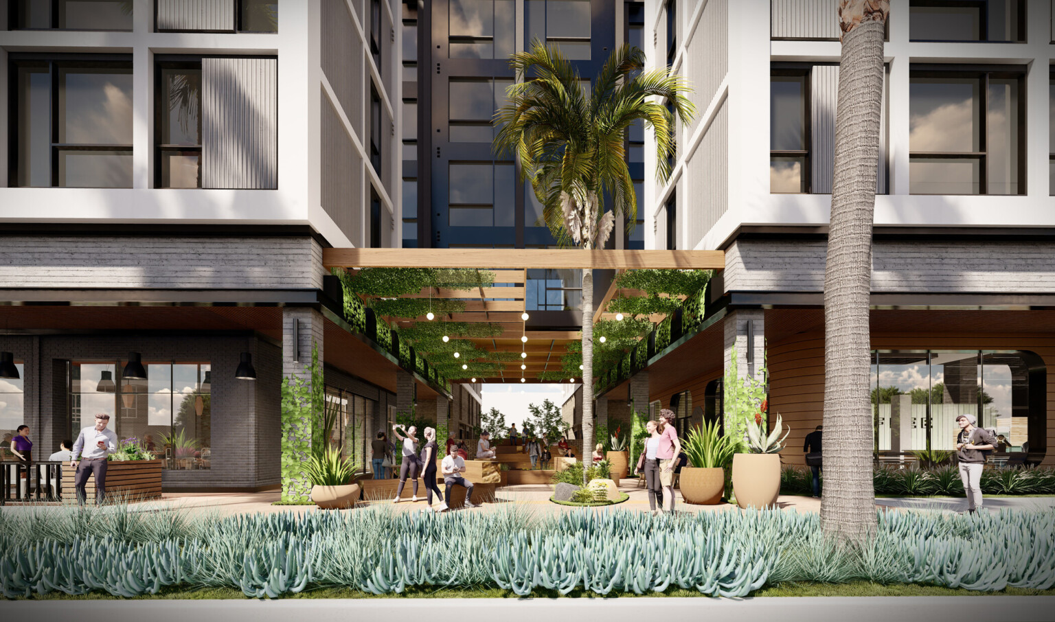 shaded pedestrian seating and walkways at the foot of a building development with palm trees and living ground cover
