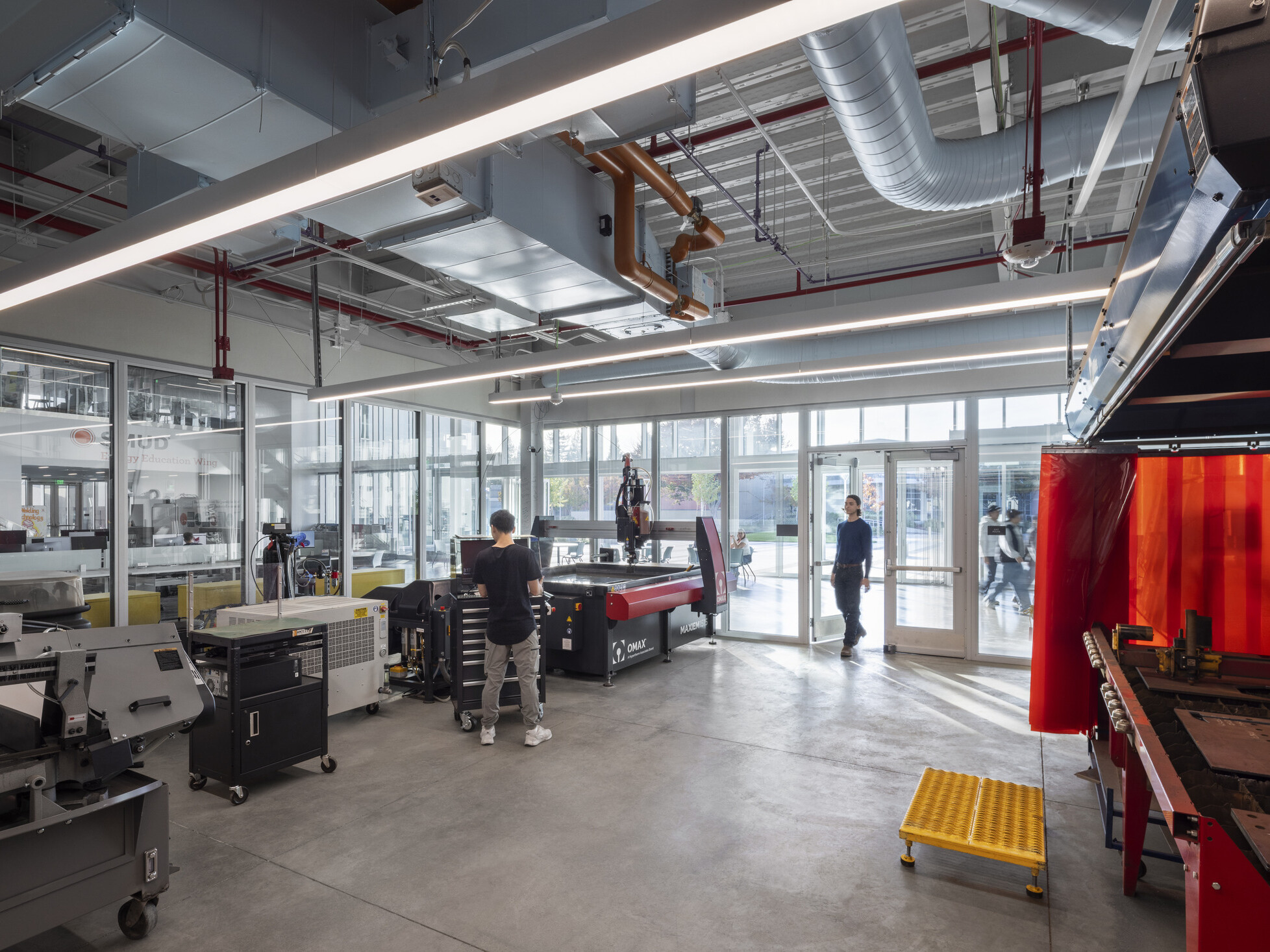 interior classroom of a technical career education space; industrial feel with specialized tools and stations