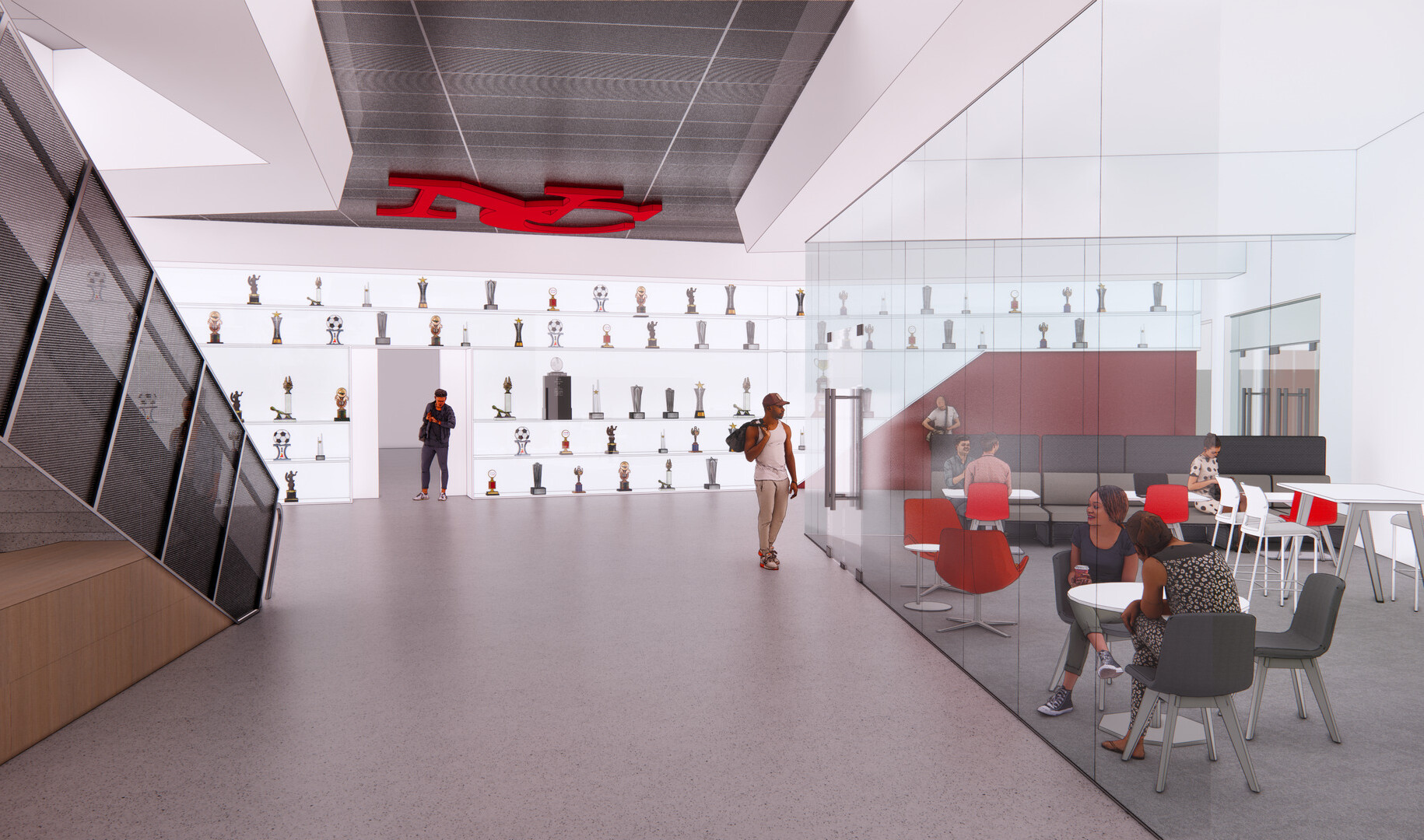 interior design of a new Human Performance and Kinesiology school; school branding front and center with athletic trophies displayed on the back wall
