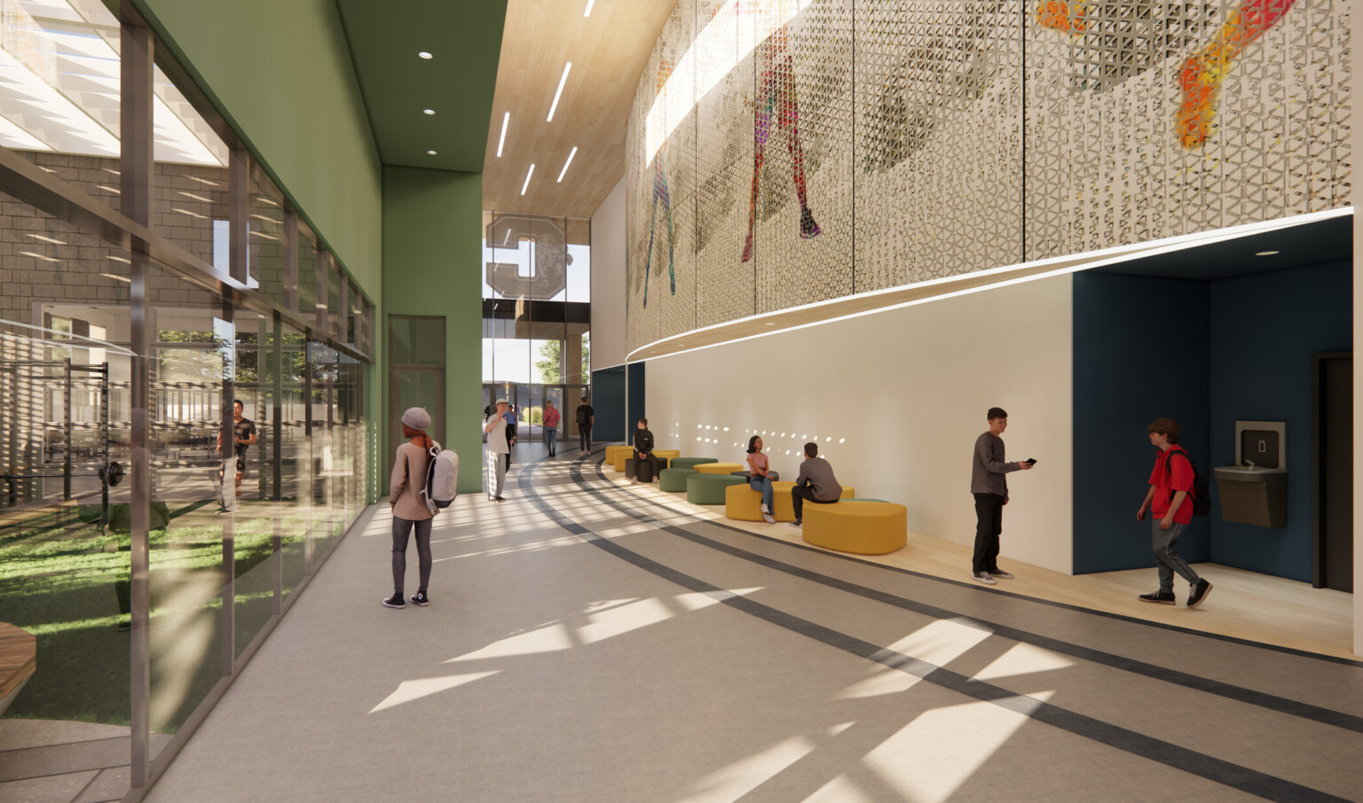 Curved hallway in chaparral high school building; large glass windows; students lounging on green and yellow couches