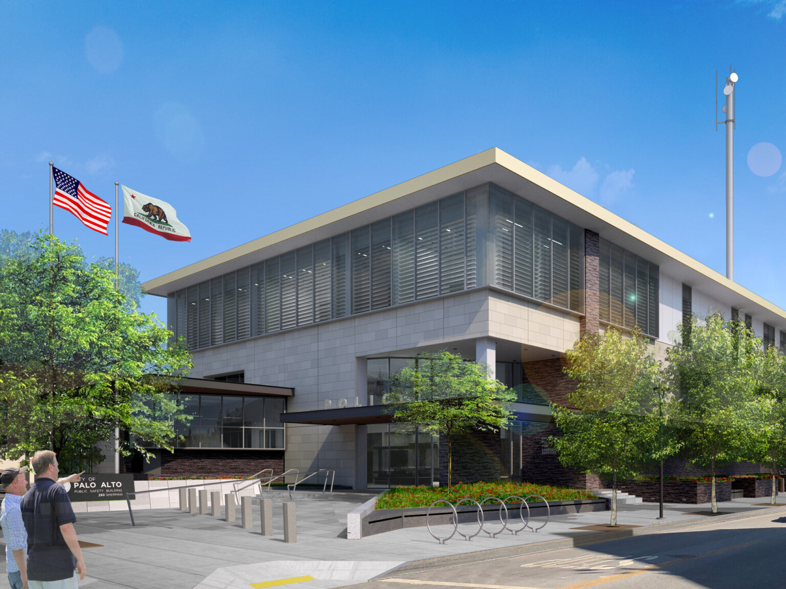 Palo Alto Public Safety Building canopied entrance to multi story light stone building, floor to ceiling windows on second floor, wrapped facade