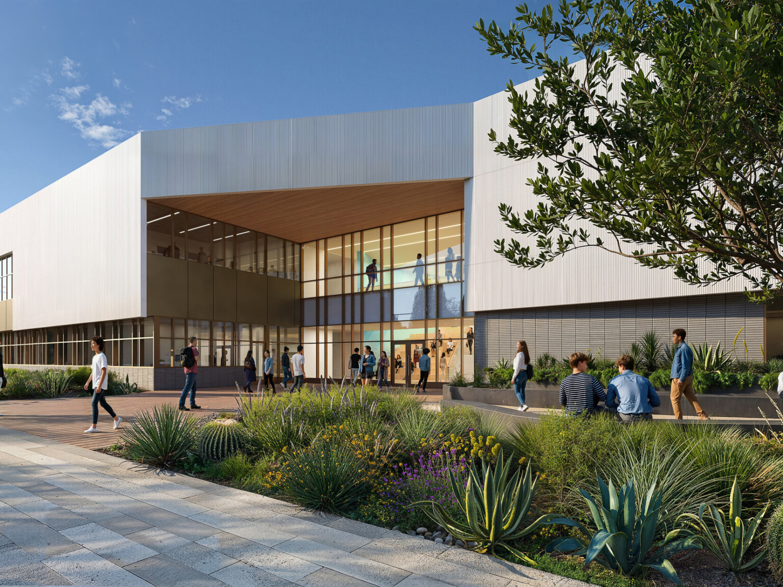 Architectural rendering of a modern high school; neutral gray and tan tones on the square elevated building; against a blue sky; with walkway of people in foreground