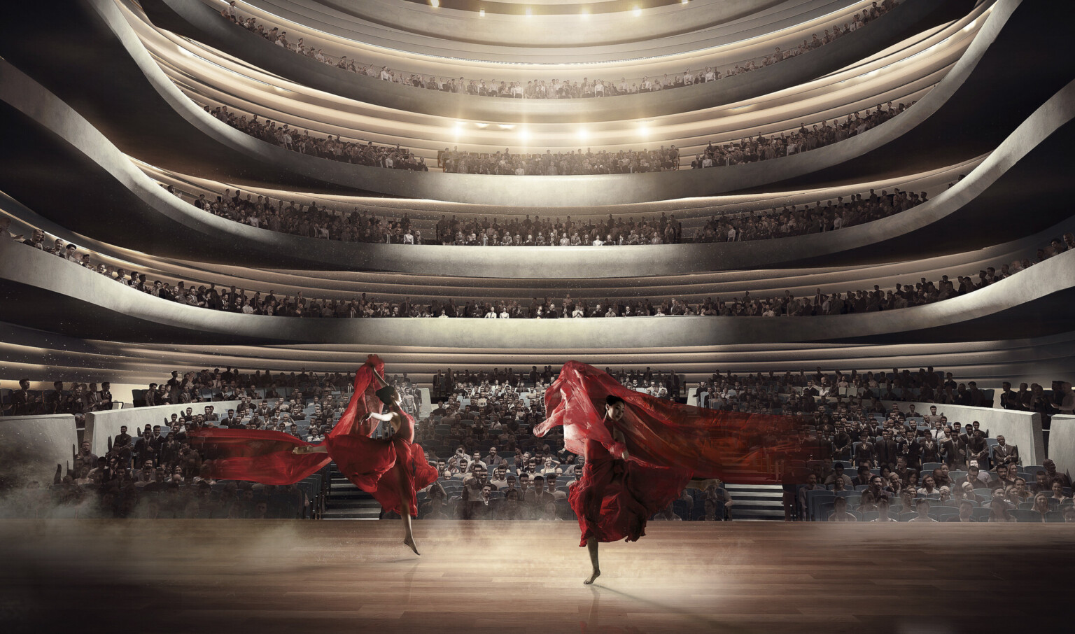 Upstage view of two dancers with red cloth lit from above center in front of audience at ground level and two balconies