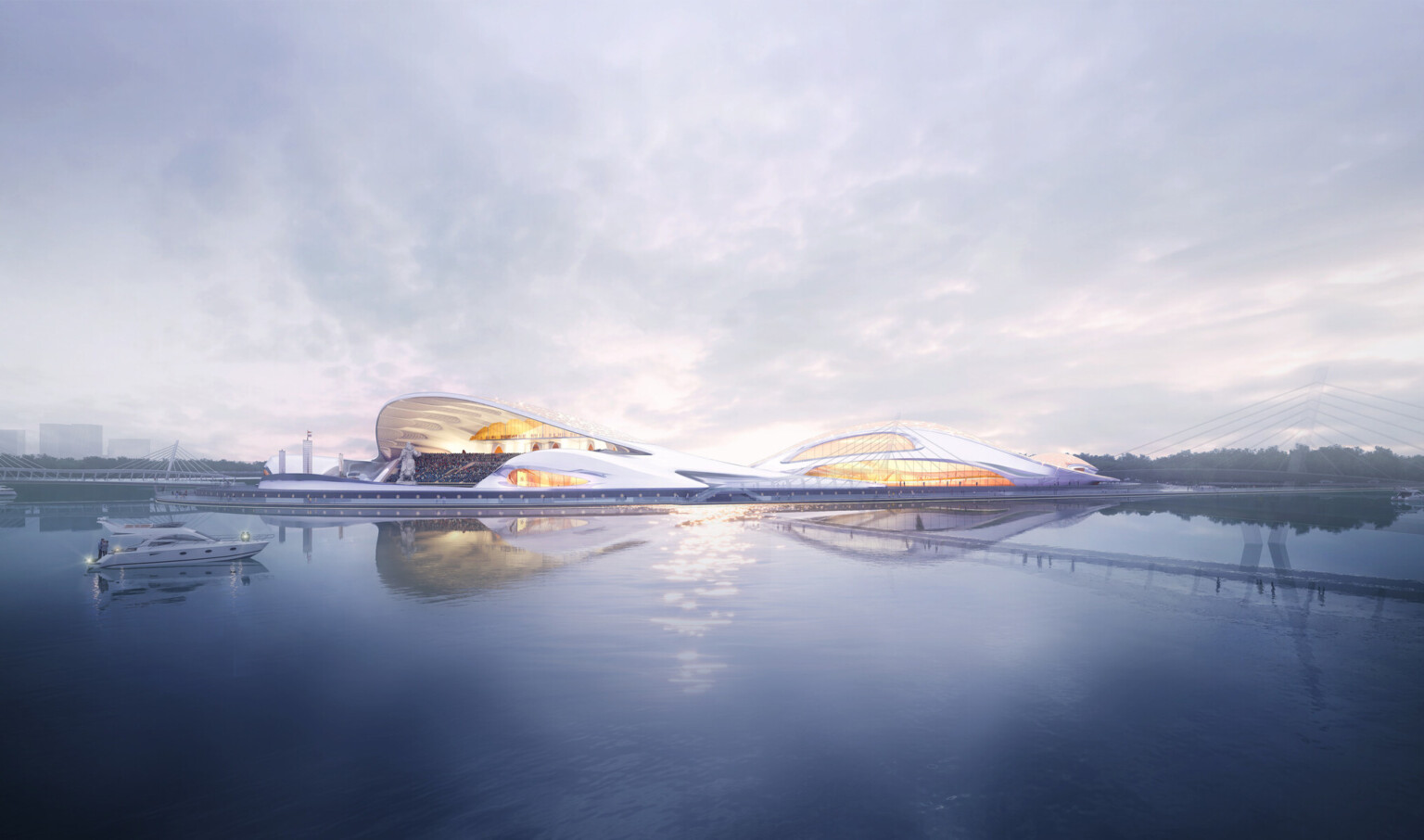 White rounded semicircular building along waterfront with canopied seating area. Complex is illuminated from within