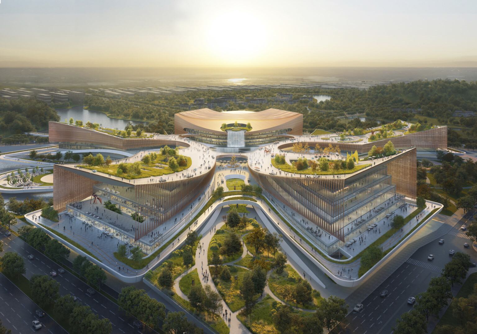 Aerial rendering of a large, modern architectural complex with multiple interconnected buildings arranged in a symmetrical, star-like pattern.