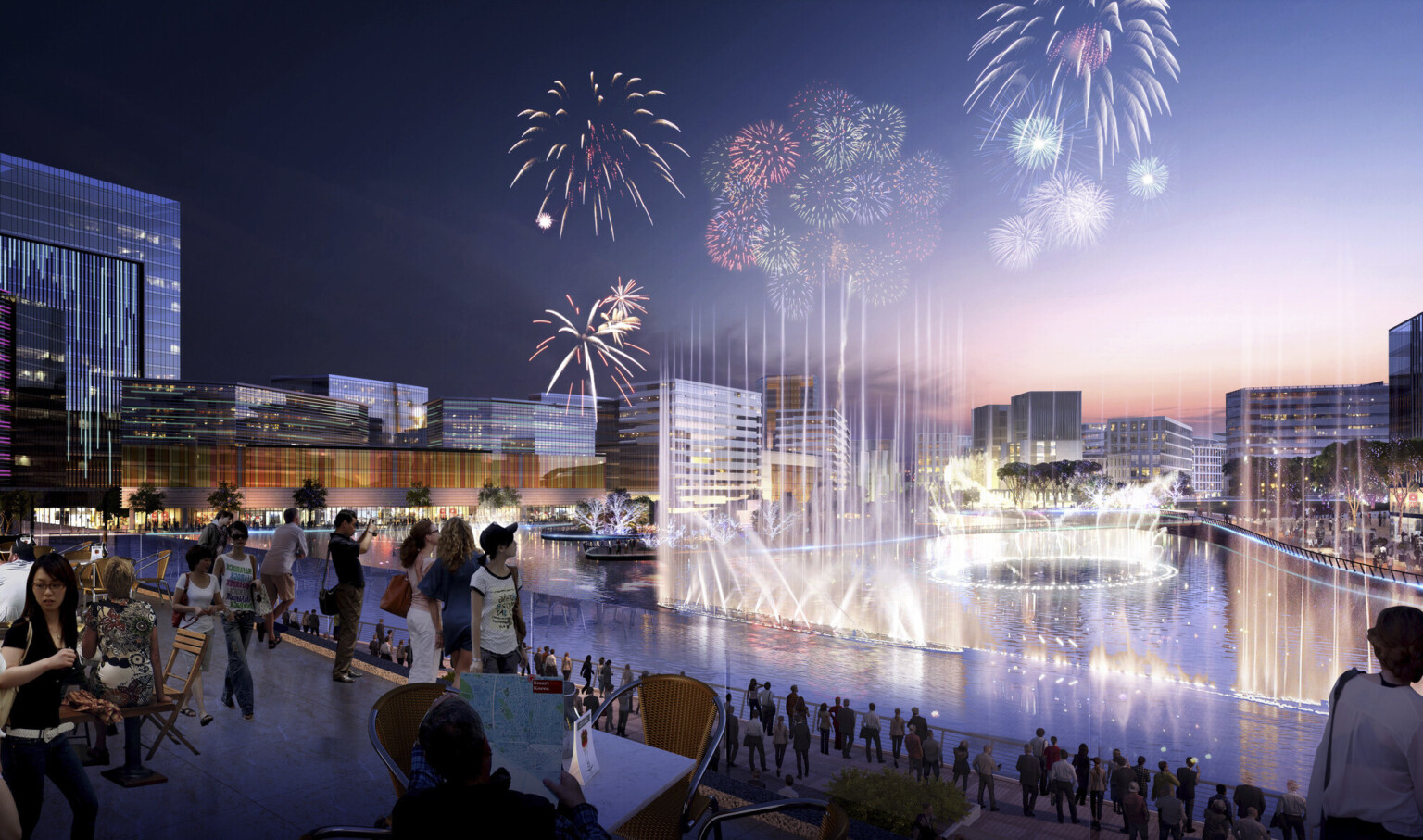 Tree lined lake with fountains surrounded by multistory glass buildings in the evening with fireworks overhead