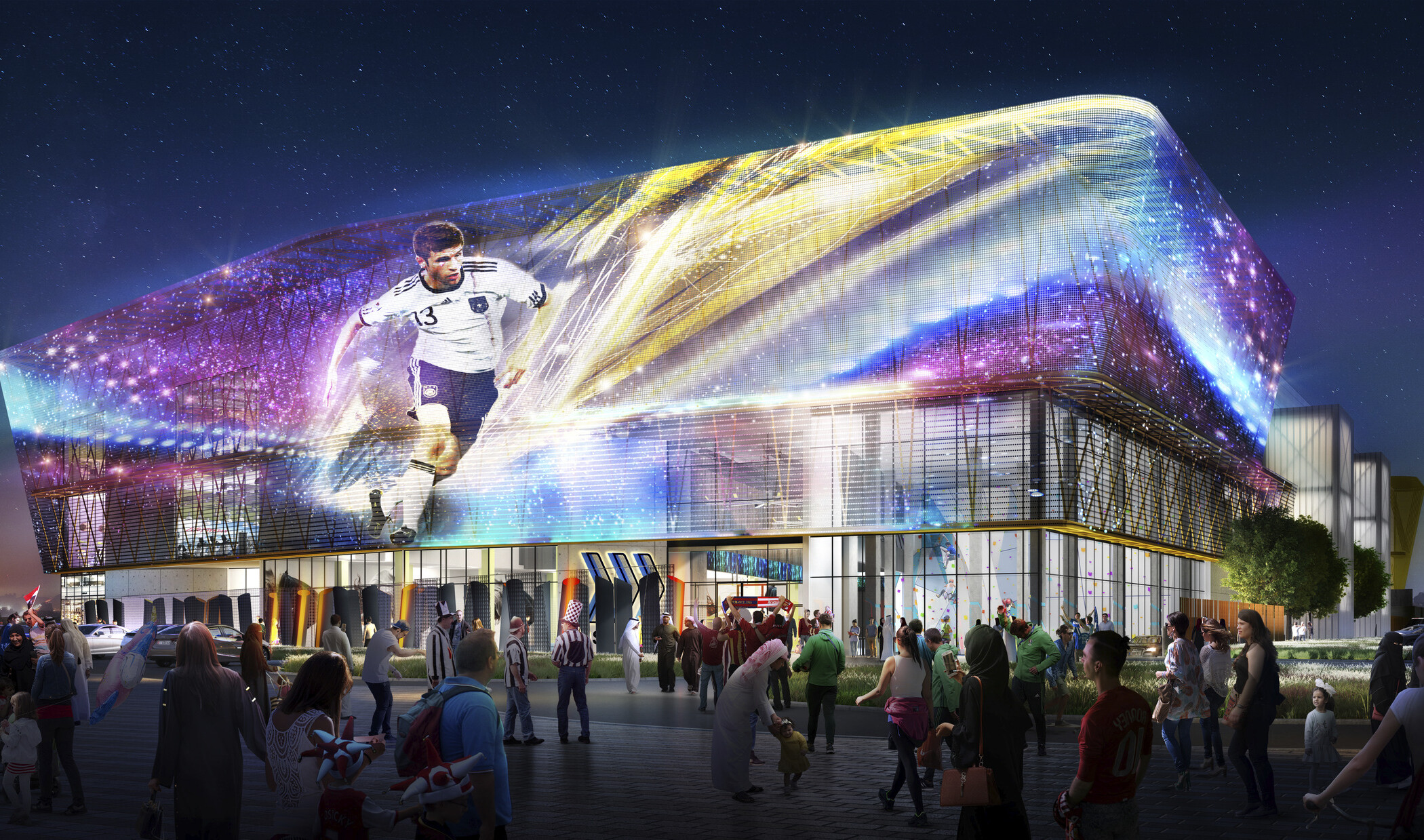 Sports Society entrance illuminated at night from double height windows. A banner hangs above of a soccer player in a galaxy