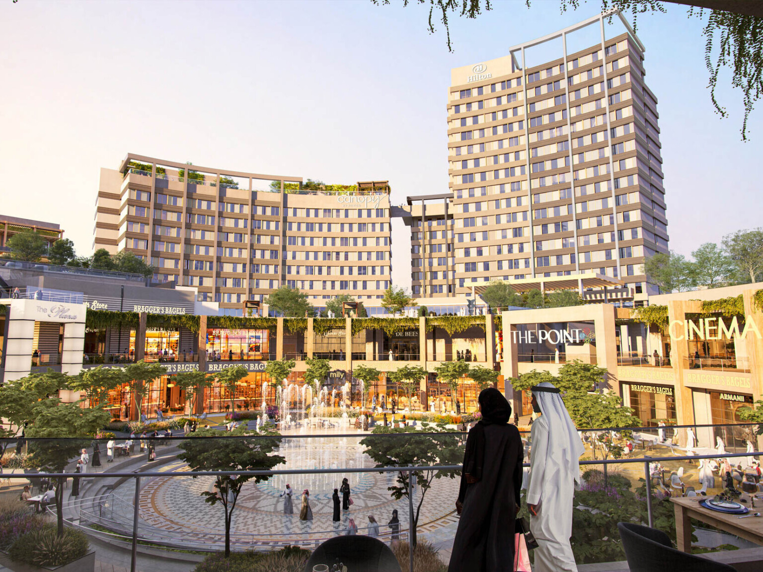 Upper level of outdoor shopping center with pathway down, seen in the evening. Multiple planters and green roofs along path