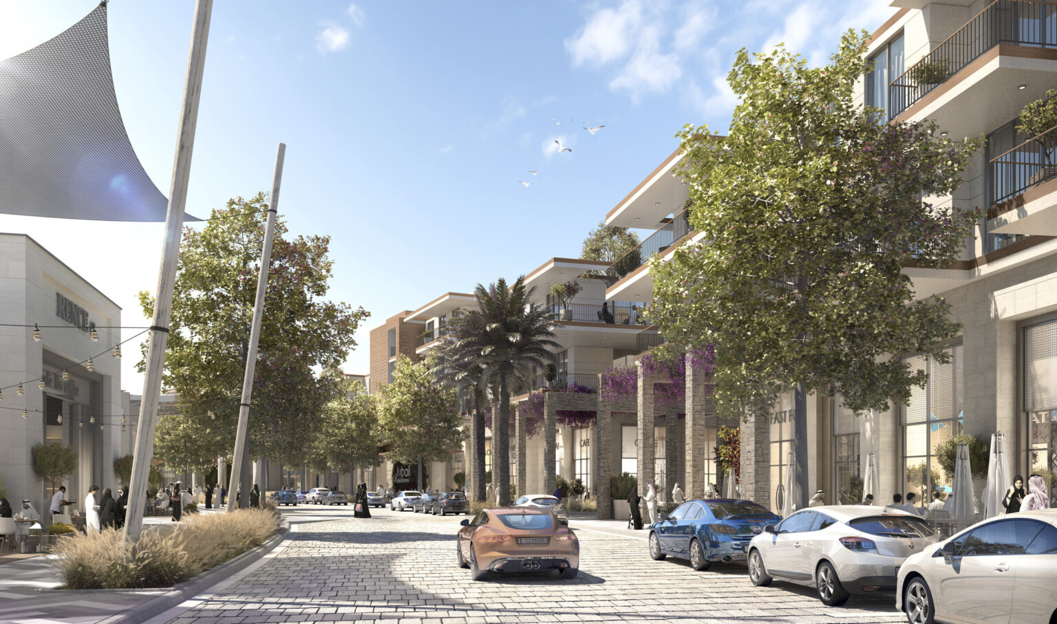Street lined with trees and multistory storefronts with brown accents. Sunscreens, left, stone trellises with flowers right
