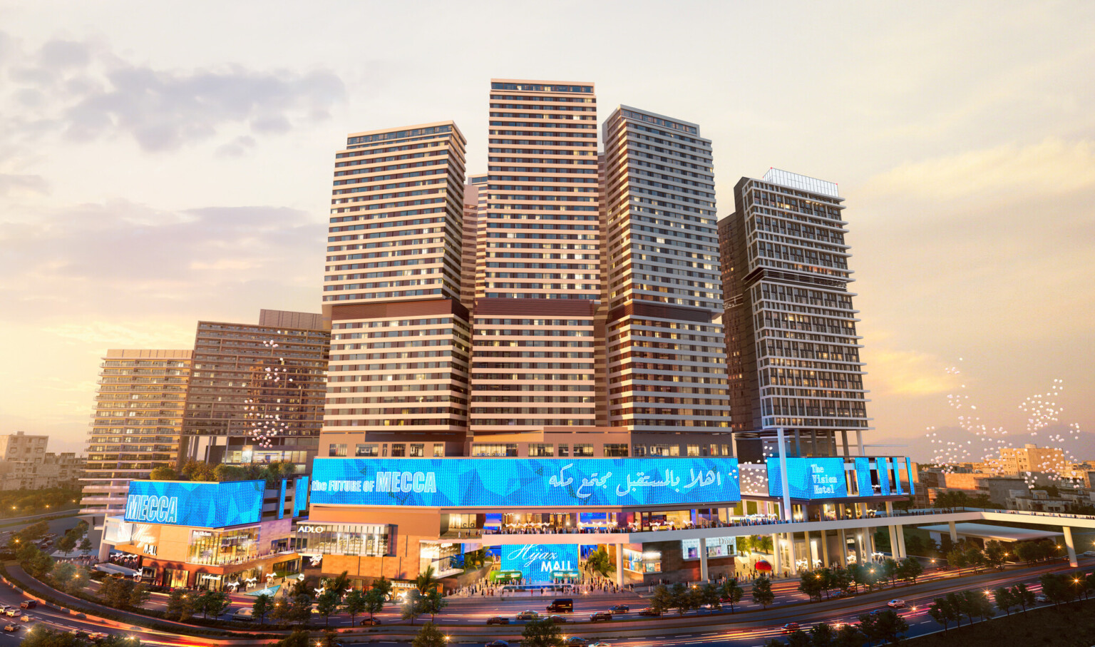 Front of shopping center with lighted display along top with garden on left roof, walkways between sections, hotel behind