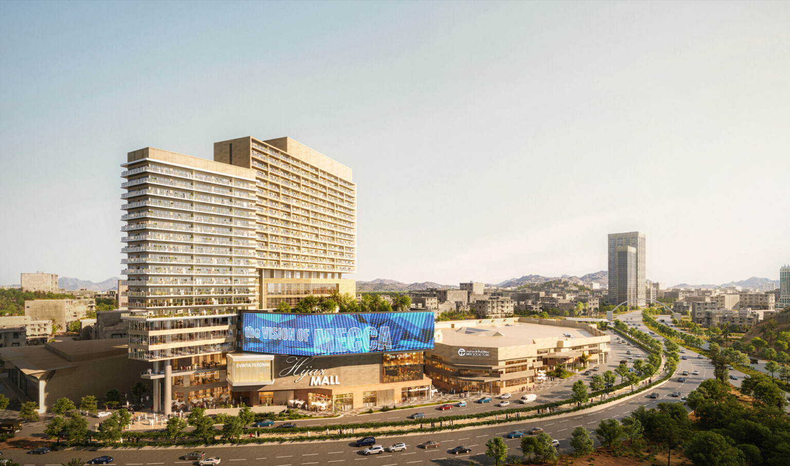 Midrise shopping center with lighted display along top with garden on left roof and tall buildings behind, view of city right