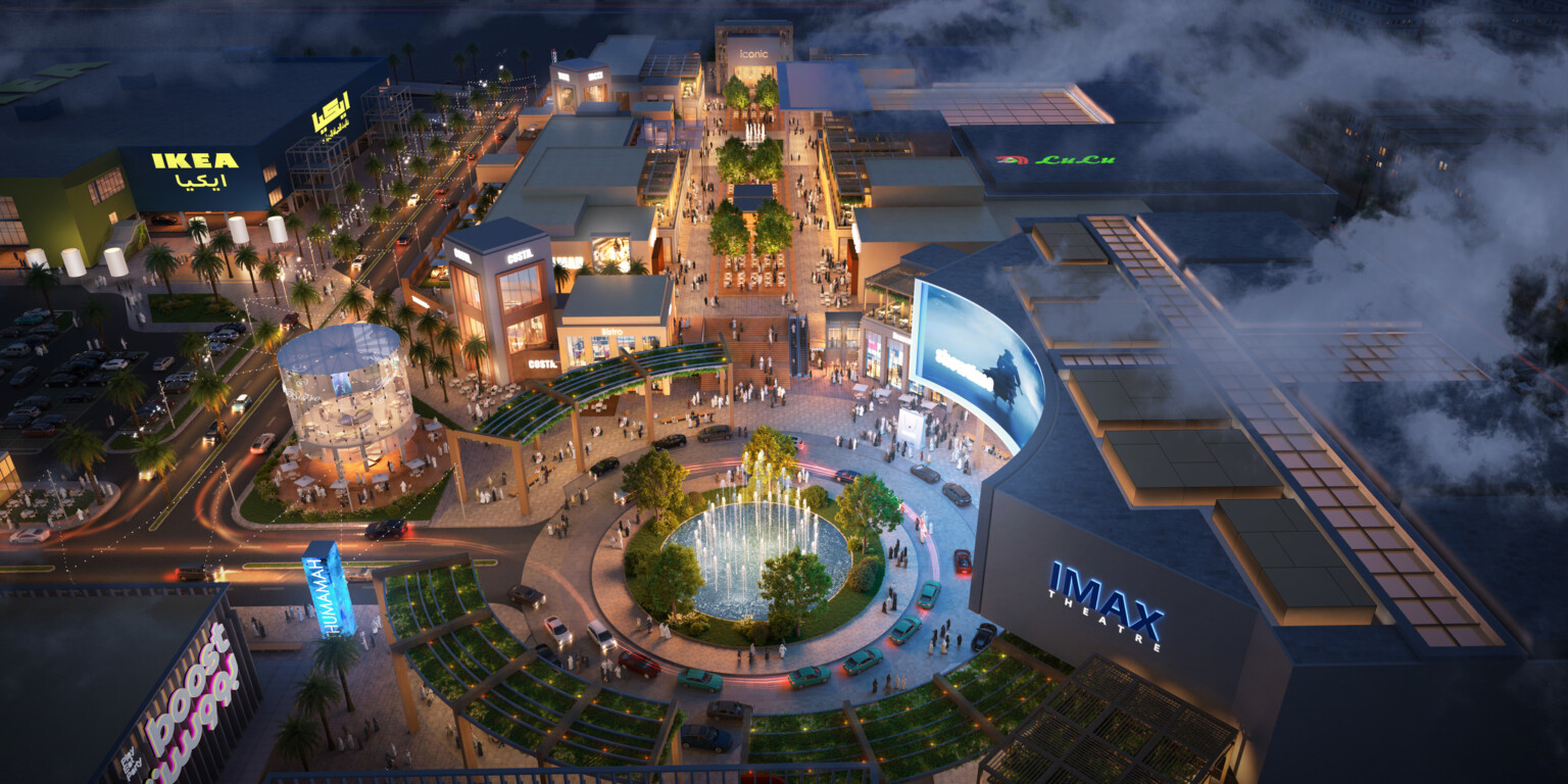 Nighttime rendering of a retail space showing large stores surrounding a water fountain