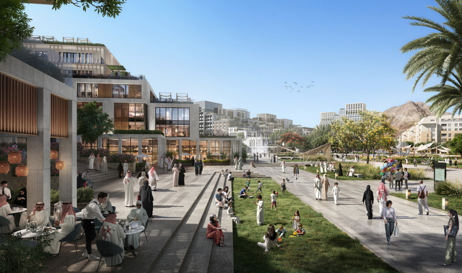 Daytime view of a lively public space featuring modern low-rise buildings, outdoor cafes, and well-maintained green areas. People are socializing, dining, and enjoying recreational activities, with palm trees and distant mountains enhancing the scenic backdrop. Daytime view of a lively public space featuring modern low-rise buildings, outdoor cafes, and well-maintained green areas. People are socializing, dining, and enjoying recreational activities, with palm trees and distant mountains enhancing the scenic backdrop.