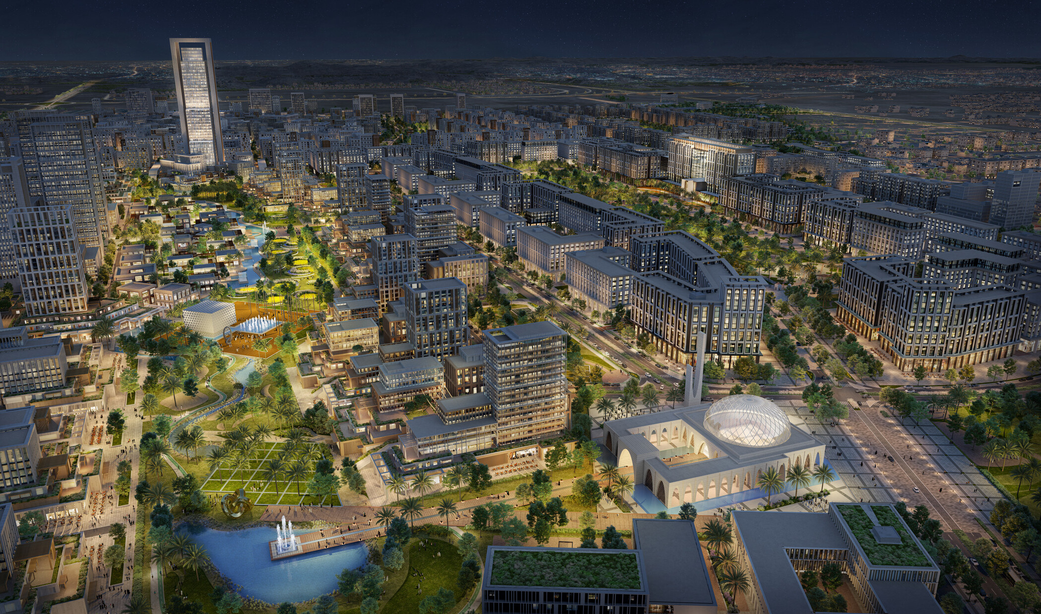 A night-time aerial view of a large urban area illuminated with various lights, highlighting the buildings, streets, and landscaped areas. The master plan features a mix of high-rise and low-rise buildings with contemporary architecture.