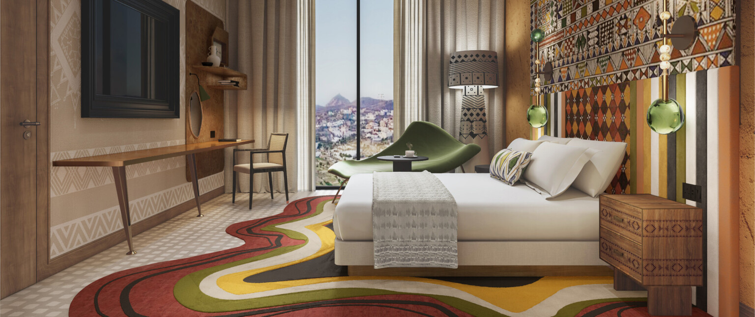 Hotel room rendering with colorful artwork, modern rug and furniture