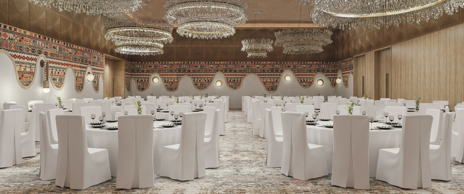 Hotel ballroom with crystal chandeliers, tables with white linens, and white covered chairs