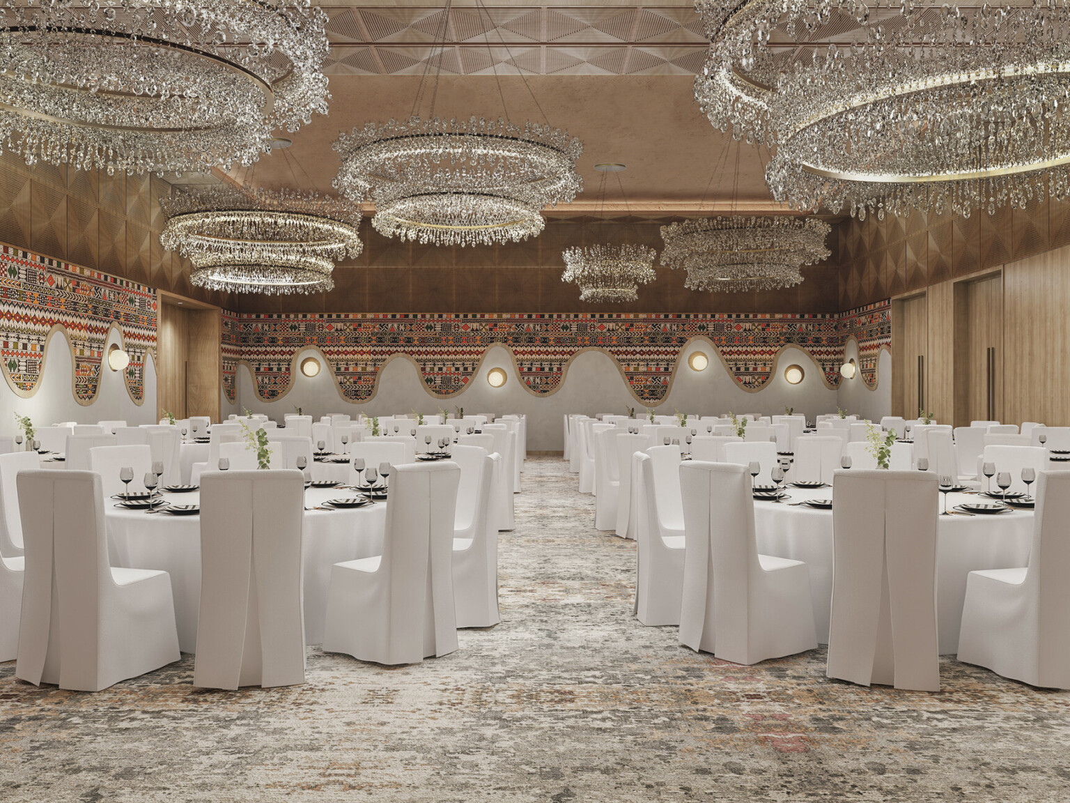 Hotel ballroom with crystal chandeliers, tables with white linens, and white covered chairs
