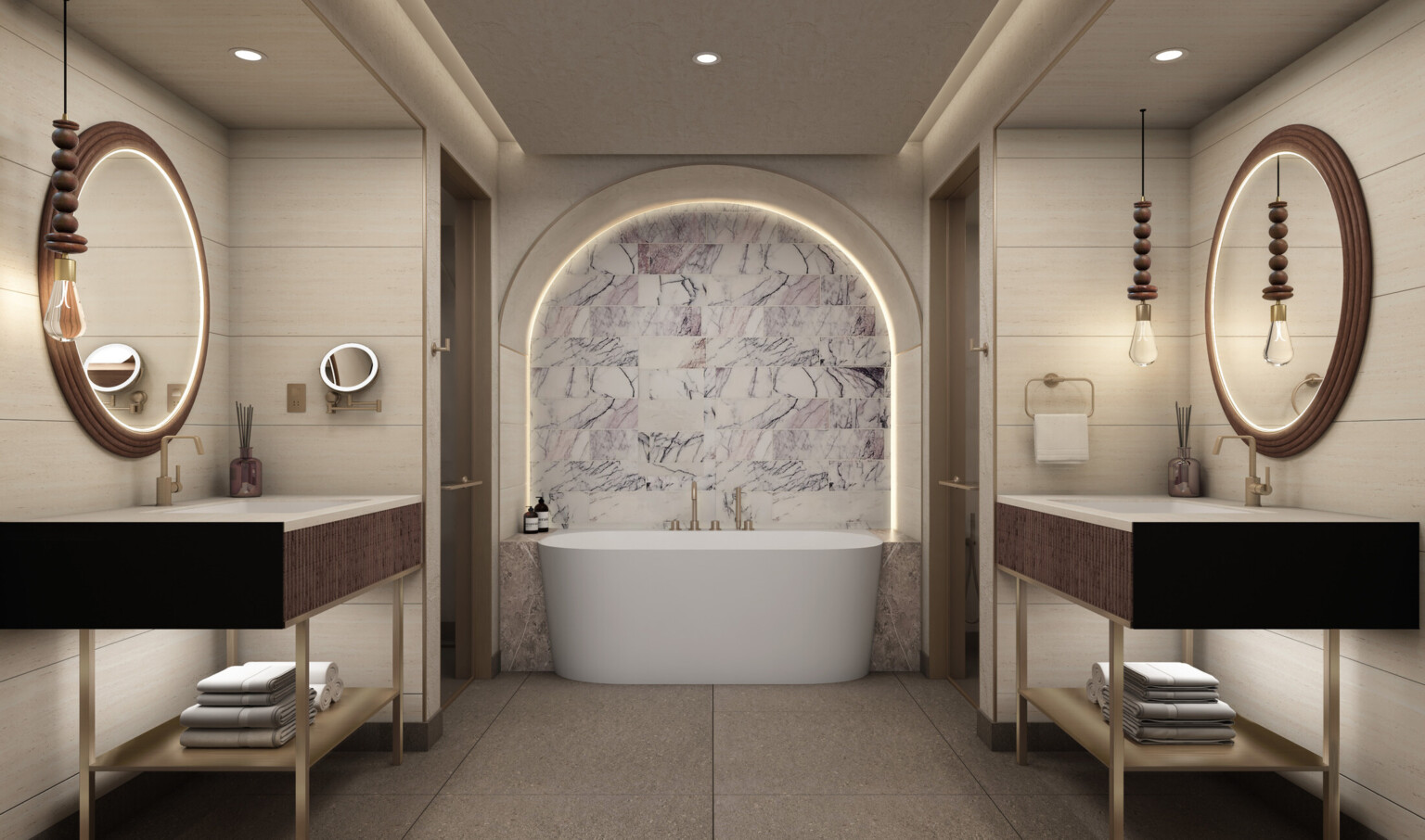 Hotel bathroom showing a large white bathtub and double sinks with dark wood accents