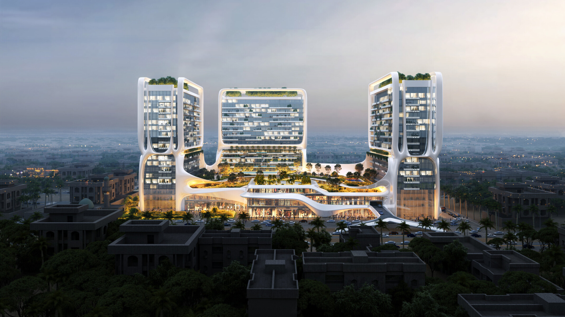 Architectural rendering of a modern three tower residential complex with interconnecting bridges, featuring illuminated facades against a twilight sky.