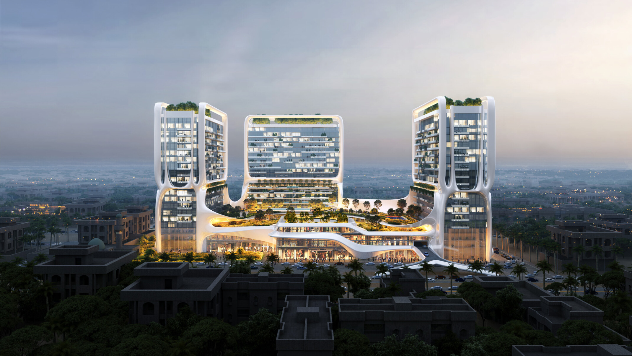 Architectural rendering of a modern three tower residential complex with interconnecting bridges, featuring illuminated facades against a twilight sky.