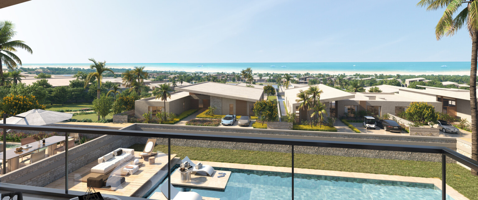 Second story view overlooking a pool with houses and beach in the distance