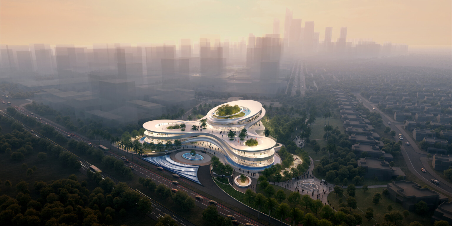An aerial view of a futuristic sales center featuring an innovative, multi-level architectural design with curving, organic shapes.