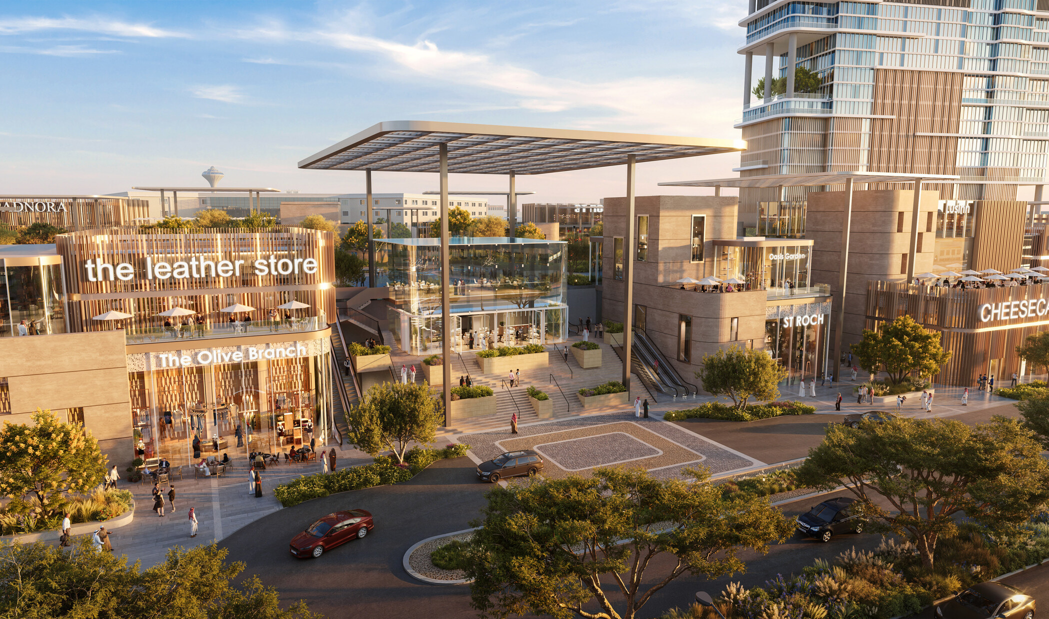 Street-facing view of SUMOU showing the retail frontage, shaded drop-off canopies, and office tower rising above a layered mixed-use podium along a primary urban corridor.