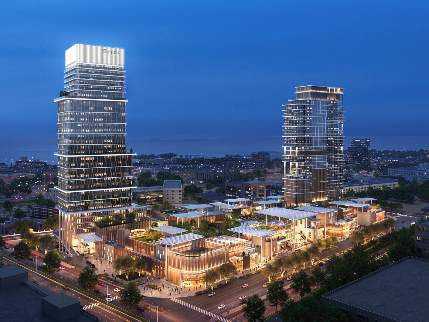 Aerial view at dusk featuring activated retail podiums, integrated public realm, and illuminated high-rise towers designed around pedestrian activity and connectivity.