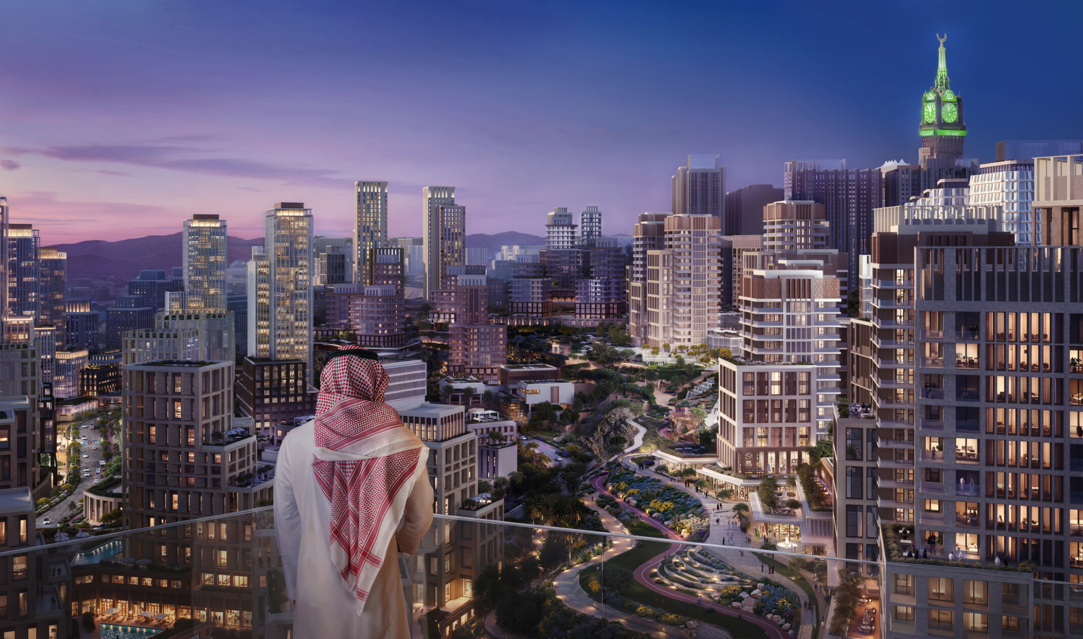 View across the MAAD masterplan in Makkah, showing a dense mixed-use urban district with landscaped public spaces and the Makkah Royal Clock Tower beyond.