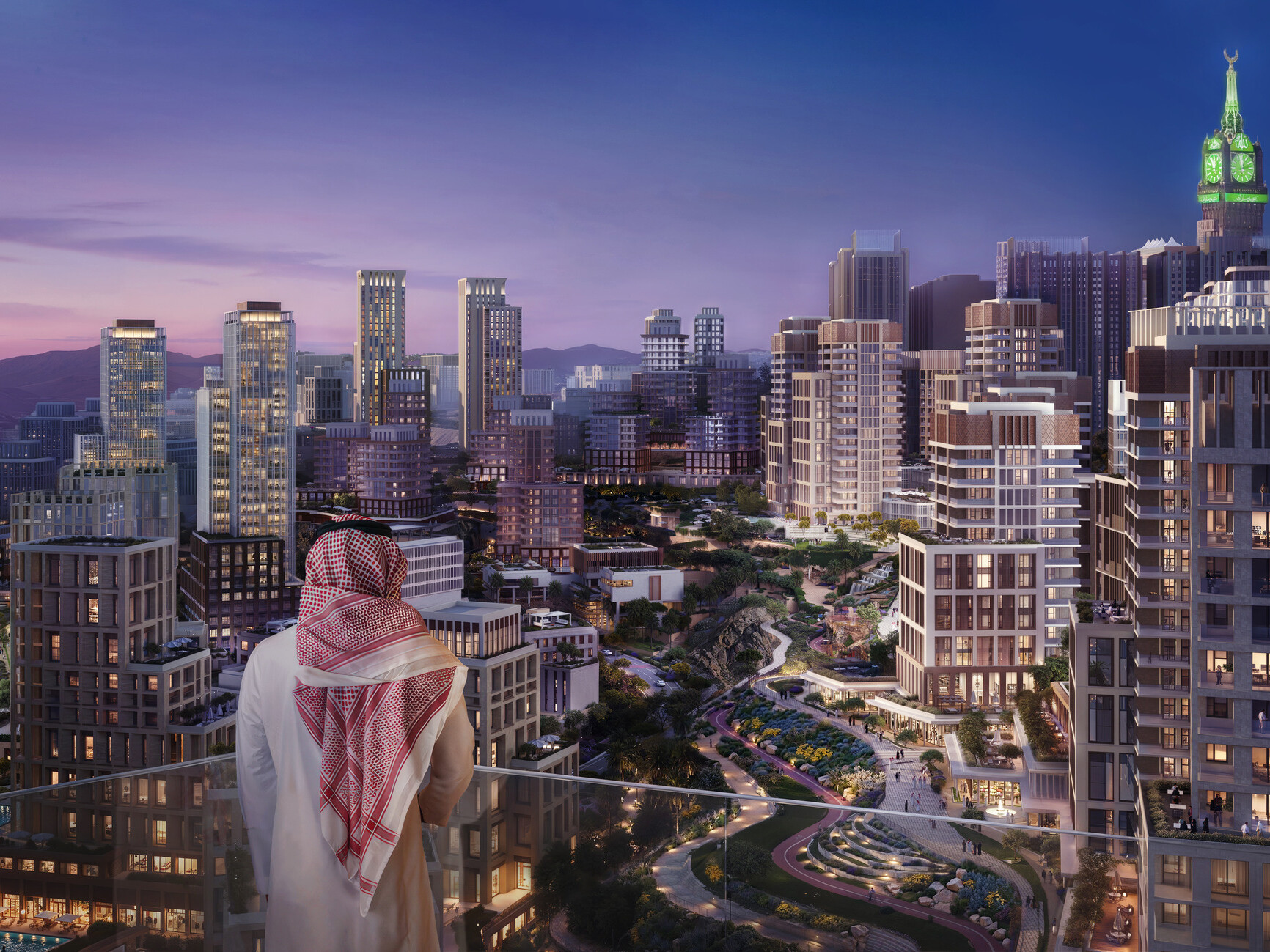 View across the MAAD masterplan in Makkah, showing a dense mixed-use urban district with landscaped public spaces and the Makkah Royal Clock Tower beyond.