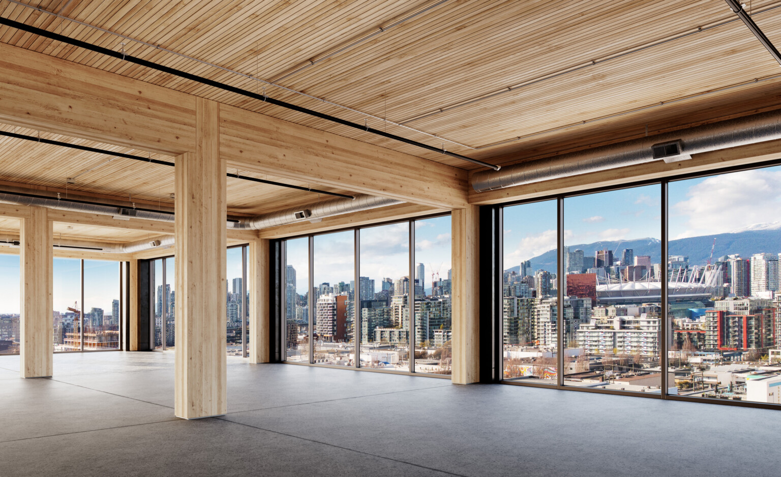 empty office building floor facing floor to ceiling windows; mass timber core building structure exposed