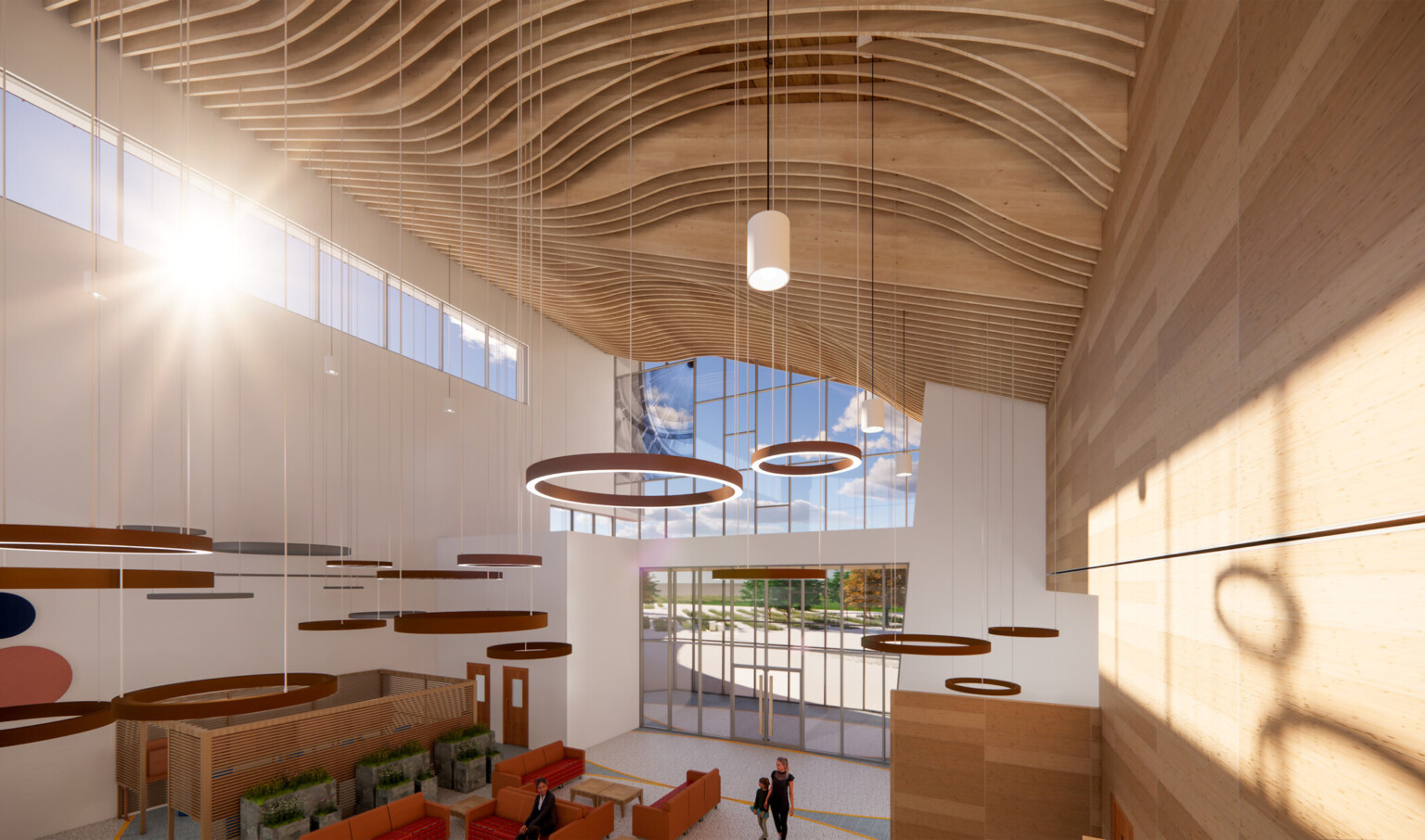 High-angle interior view of a grand lobby with arched wood ceilings, floor-to-ceiling windows, hanging circular lights, orange seating, and planters.