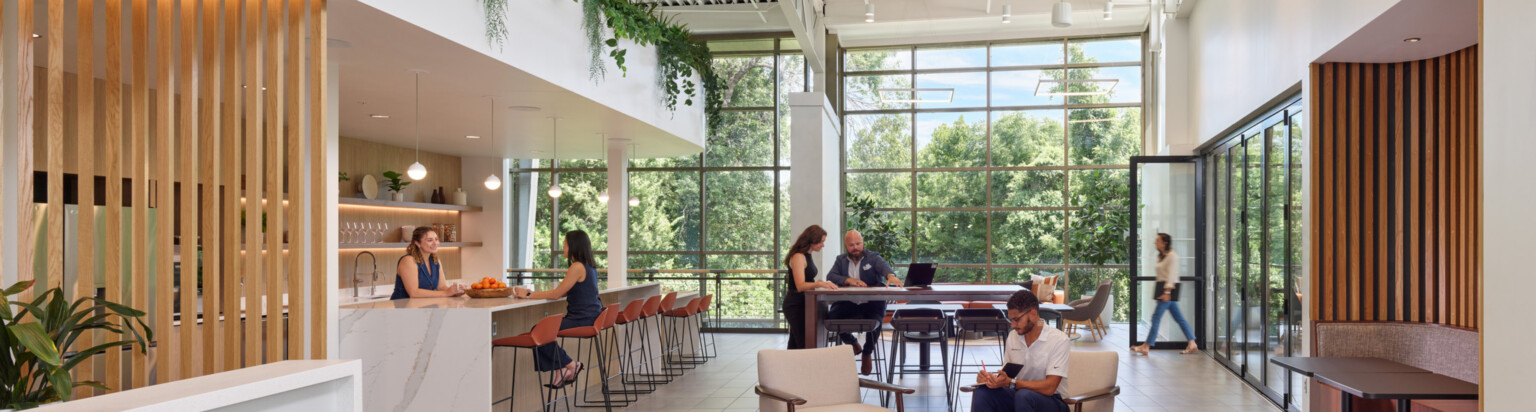 modern office communal kitchen area with bar seating and modular seating; DLR Group Kansas City office
