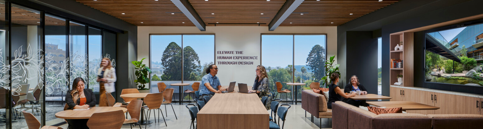 modern office collaboration space; booths, high-tops and tables throughout the space; DLR Group Riverside office