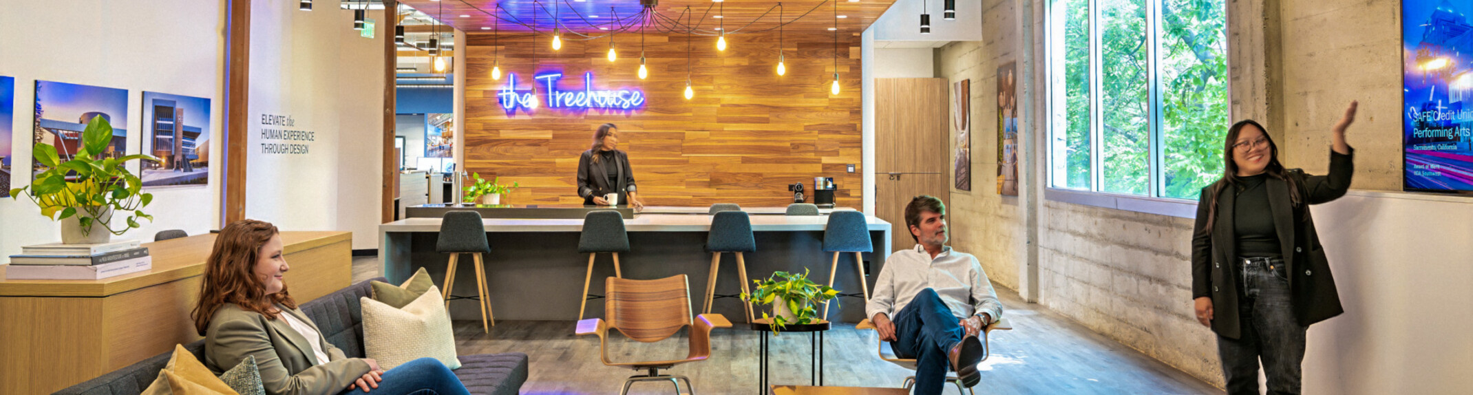 modern office collaboration zone with "the treehouse" coffee bar in the background; DLR Group Sacramento office