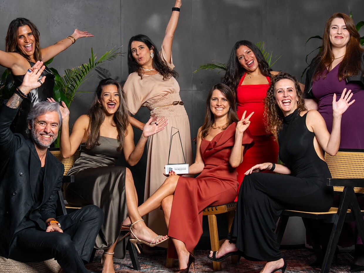 employees cheering in a professional photoshoot setting